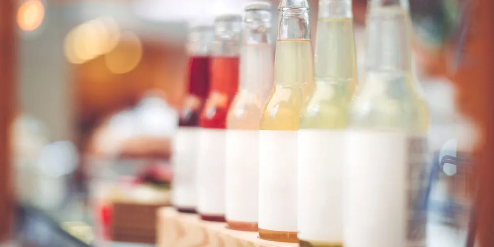 Glass beverage bottles with unprinted labels Glass beverage bottles with unprinted labels