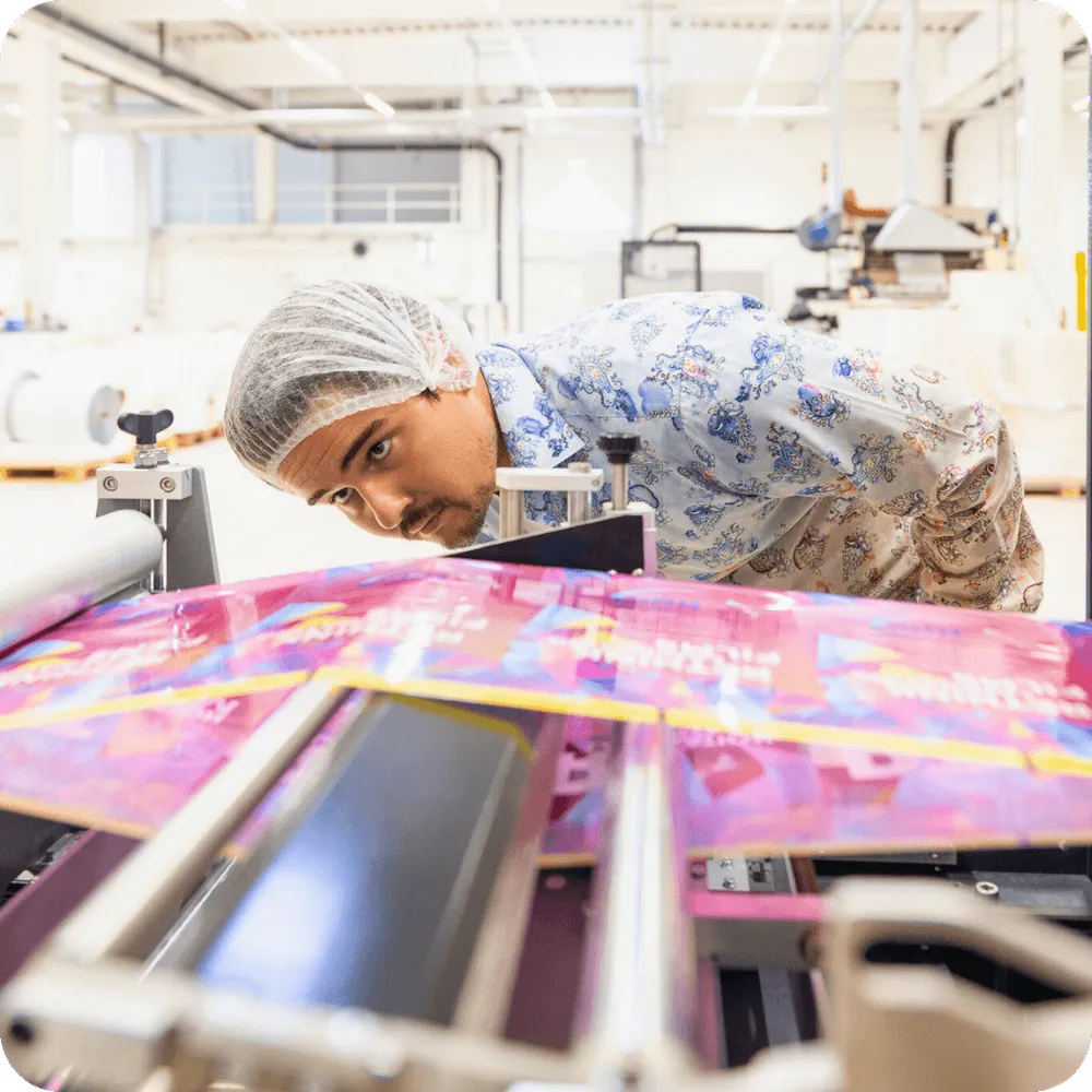 Man looking at Doypack machine Man looking at Doypack machine