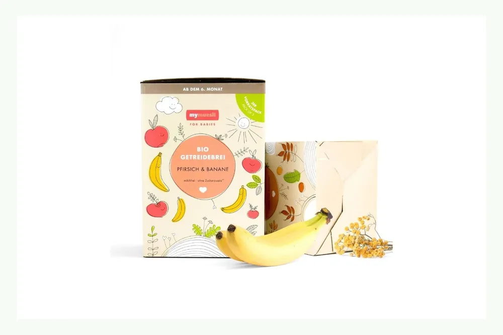 Confezione alimentare con barattolo, scatola e banana Confezione alimentare con barattolo, scatola e banana